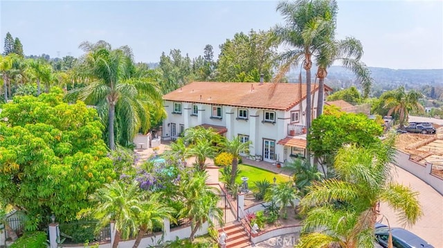 7680 E Eucalyptus Way, Anaheim Hills, CA 92808 - back of property with stucco siding and a tile roof