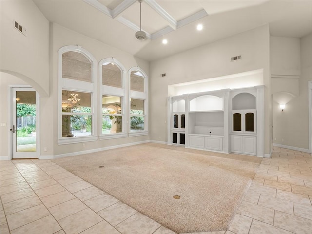 6660 N St Catherine Ct, Fresno, CA 93711 - unfurnished living room featuring a high ceiling, coffered ceiling, arched walkways, recessed lighting, and beam ceiling