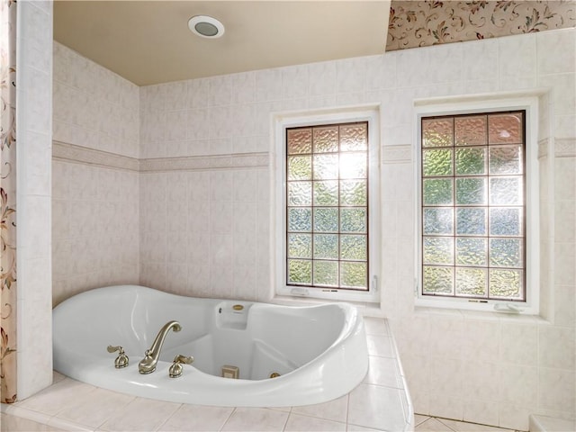 6660 N St Catherine Ct, Fresno, CA 93711 - bathroom with a whirlpool tub, healthy amount of natural light, and tile walls