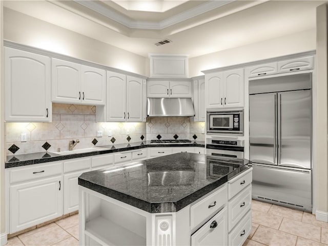 6660 N St Catherine Ct, Fresno, CA 93711 - kitchen with built in appliances, under cabinet range hood, open shelves, white cabinets, and light tile patterned flooring