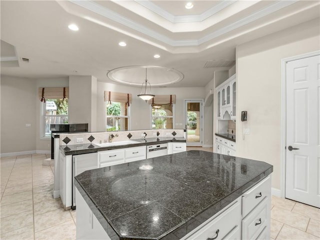 6660 N St Catherine Ct, Fresno, CA 93711 - kitchen featuring a large island, a raised ceiling, recessed lighting, crown molding, and light tile patterned floors