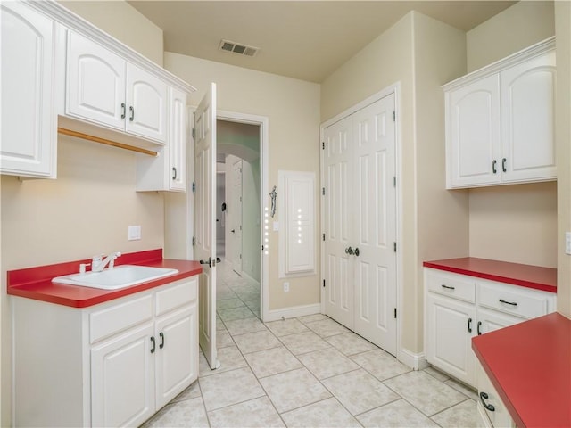 6660 N St Catherine Ct, Fresno, CA 93711 - kitchen featuring light tile patterned flooring and white cabinetry