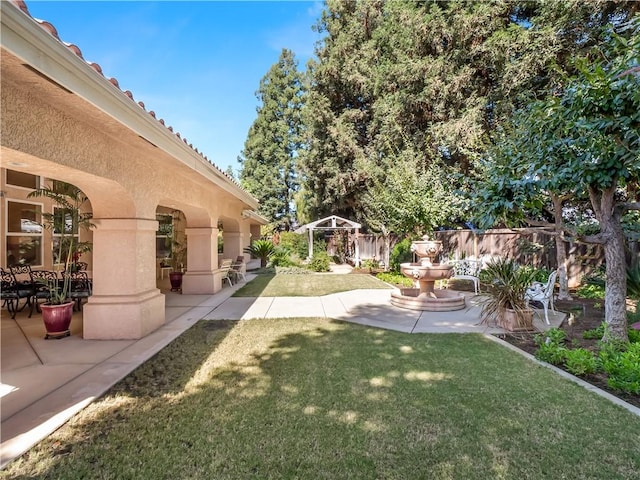 6660 N St Catherine Ct, Fresno, CA 93711 - view of yard featuring a patio