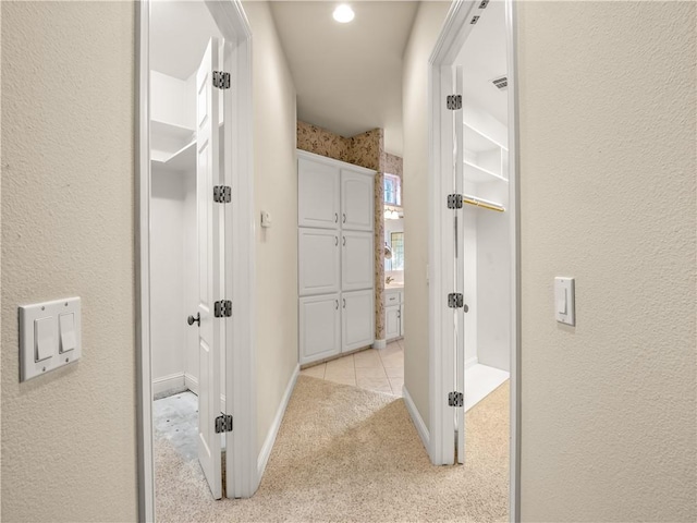 6660 N St Catherine Ct, Fresno, CA 93711 - hallway with light carpet and baseboards