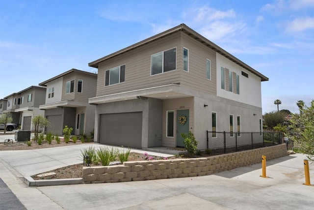 2210 Bonita Ct, Lemon Grove, CA 91945 - modern home with an attached garage, concrete driveway, and stucco siding