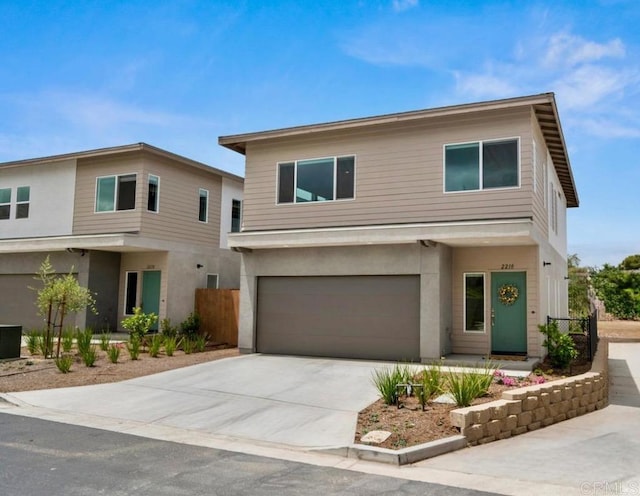 2210 Bonita Ct, Lemon Grove, CA 91945 - view of front facade featuring an attached garage, driveway, and stucco siding