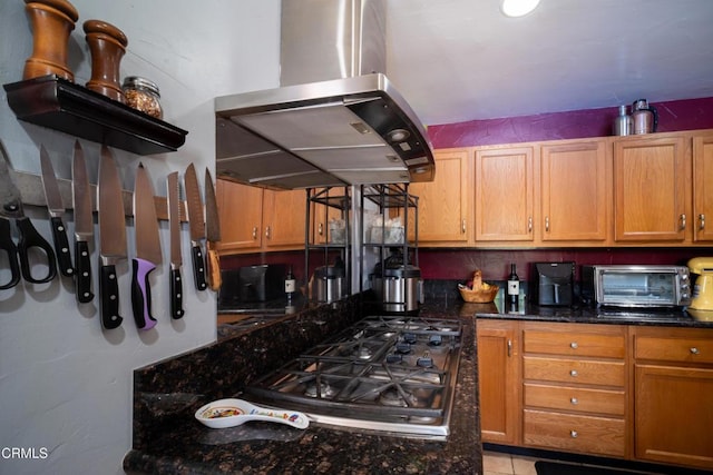 1742 Forar Cir, Camarillo, CA 93010 - kitchen with island exhaust hood, stainless steel gas cooktop, dark stone countertops, and brown cabinets