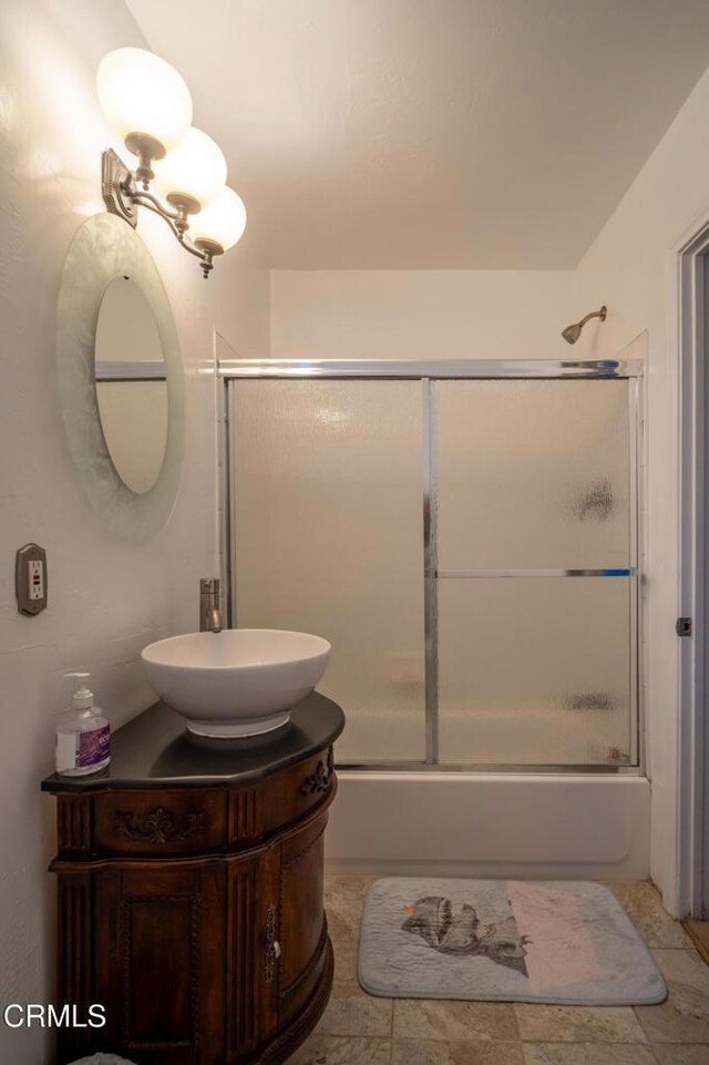 1742 Forar Cir, Camarillo, CA 93010 - bathroom featuring vanity and bath / shower combo with glass door