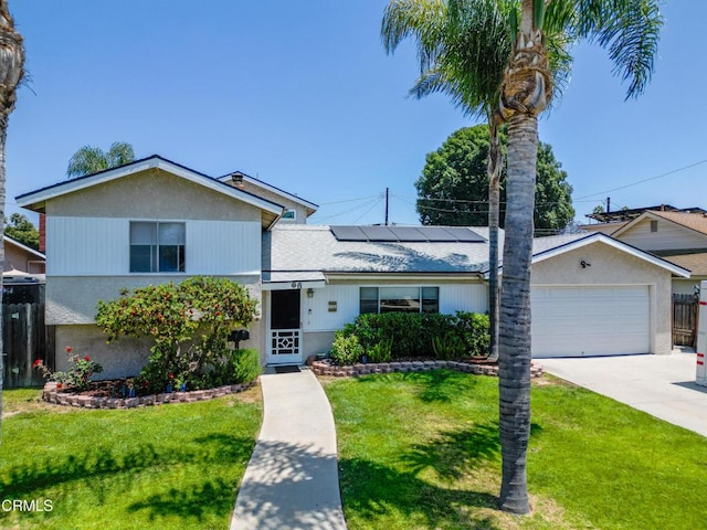 1742 Forar Cir, Camarillo, CA 93010 - view of front of house featuring solar panels, driveway, and an attached garage