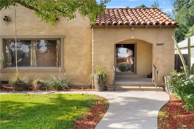 3007 Park Way, Bakersfield, CA 93304 - property entrance with stucco siding and a lawn