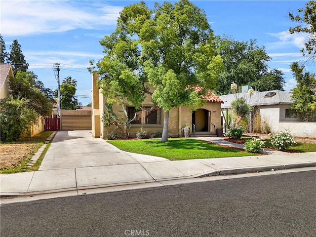 3007 Park Way, Bakersfield, CA 93304 - view of front of property featuring driveway, stucco siding, and a gate