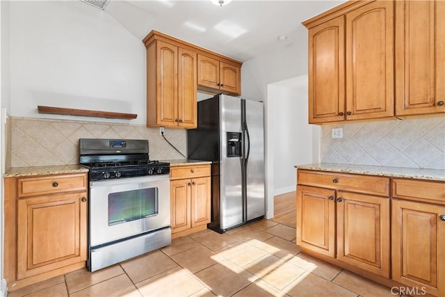3007 Park Way, Bakersfield, CA 93304 - kitchen with appliances with stainless steel finishes, light stone countertops, and decorative backsplash