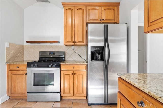 3007 Park Way, Bakersfield, CA 93304 - kitchen featuring appliances with stainless steel finishes, light stone counters, tasteful backsplash, and light tile patterned floors