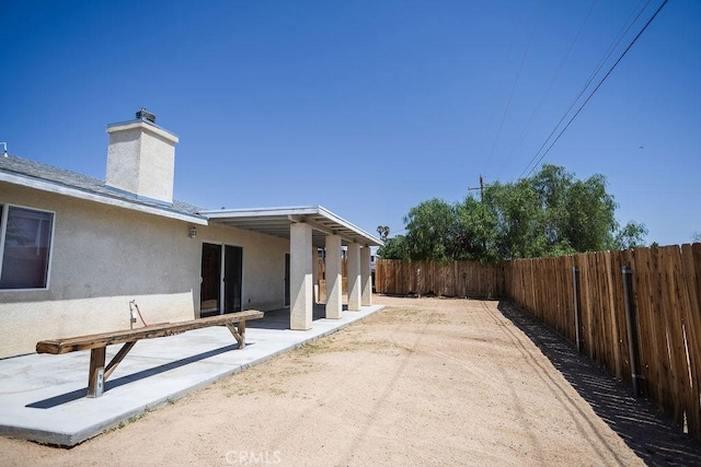 6025 Abronia Ave Unit 29, Palms, CA 92277 - fenced backyard with a patio