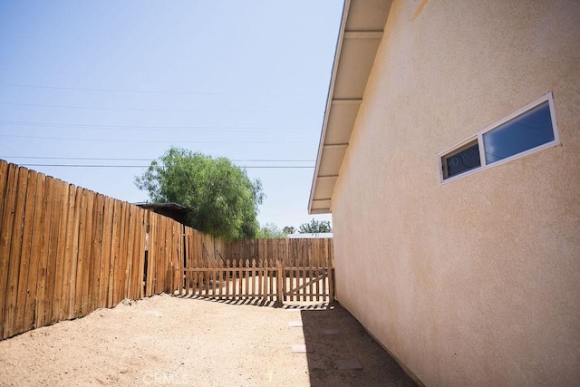 6025 Abronia Ave Unit 29, Palms, CA 92277 - view of side of property with stucco siding