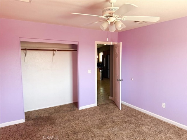 6025 Abronia Ave Unit 29, Palms, CA 92277 - unfurnished bedroom with carpet flooring, freestanding refrigerator, a closet, and a ceiling fan