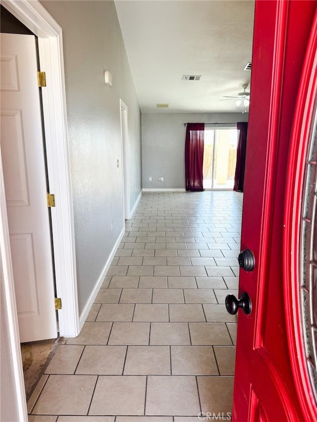 6025 Abronia Ave Unit 29, Palms, CA 92277 - hallway featuring baseboards and tile patterned floors