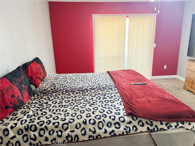6025 Abronia Ave Unit 29, Palms, CA 92277 - carpeted bedroom featuring baseboards