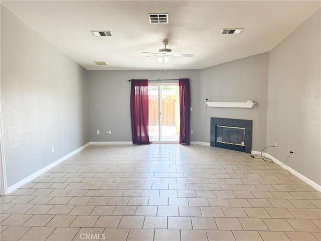 6025 Abronia Ave Unit 29, Palms, CA 92277 - unfurnished living room featuring a ceiling fan and a tile fireplace