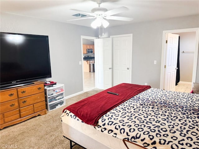 6025 Abronia Ave Unit 29, Palms, CA 92277 - carpeted bedroom featuring ceiling fan and baseboards