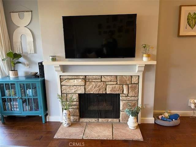 3641 S Bear St Unit F, Santa Ana, CA 92704 - detailed view of wood finished floors and a fireplace