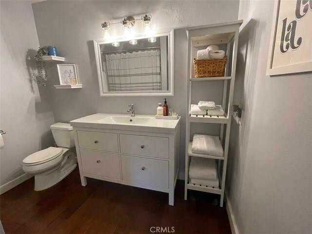 3641 S Bear St Unit F, Santa Ana, CA 92704 - full bath featuring vanity, wood finished floors, and a shower with curtain