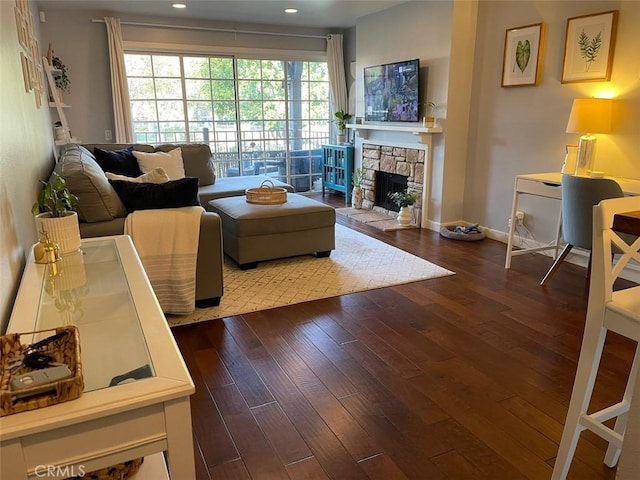 3641 S Bear St Unit F, Santa Ana, CA 92704 - living area with wood-type flooring, recessed lighting, and a stone fireplace