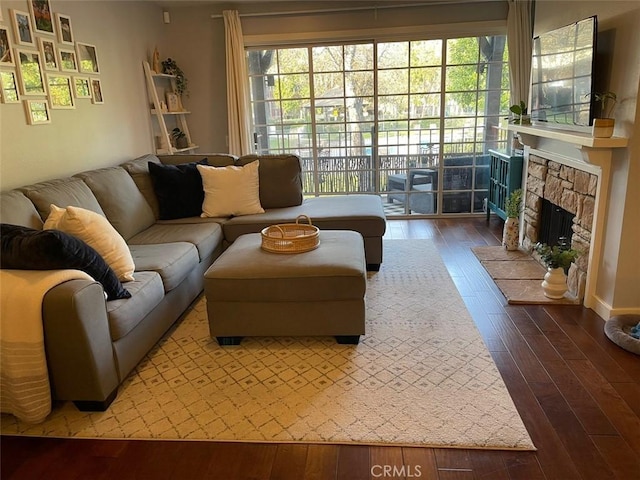 3641 S Bear St Unit F, Santa Ana, CA 92704 - living area featuring wood-type flooring and a fireplace