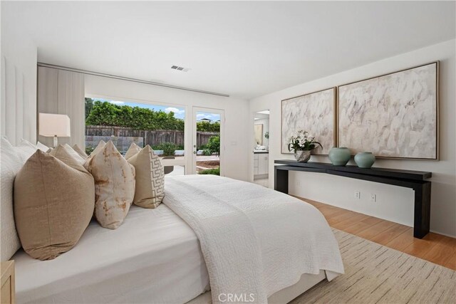32512 Seven Seas Dr, Dana Point, CA 92629 - bedroom with access to outside and wood finished floors