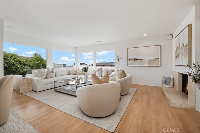 32512 Seven Seas Dr, Dana Point, CA 92629 - living area with wood finished floors, a high end fireplace, and recessed lighting
