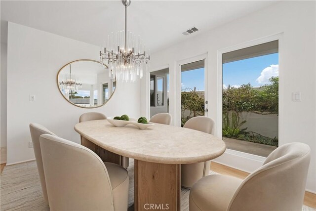 32512 Seven Seas Dr, Dana Point, CA 92629 - dining space with a chandelier and light wood-style floors