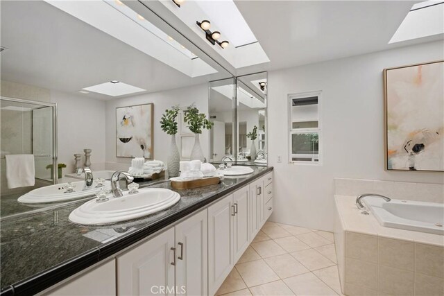 32512 Seven Seas Dr, Dana Point, CA 92629 - full bath featuring a skylight, double vanity, a bath, and a shower stall