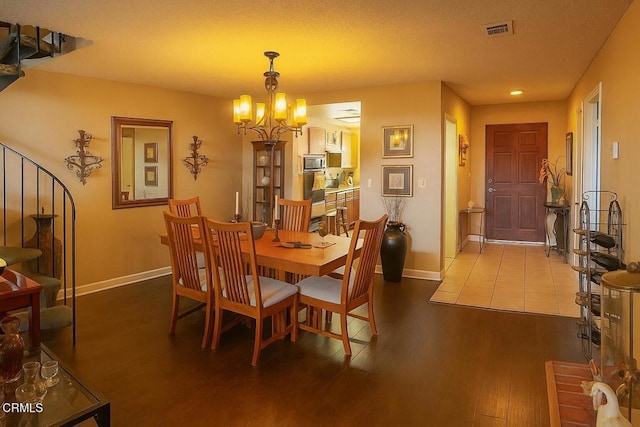 758 W Foothill Blvd, Monrovia, CA 91016 - dining room with dark wood-type flooring, a chandelier, and recessed lighting