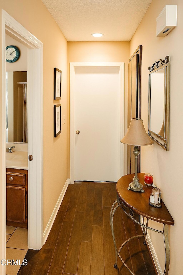 758 W Foothill Blvd, Monrovia, CA 91016 - hall featuring dark wood-style floors and baseboards