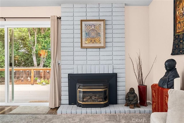 11 Tilden Ln, Chico, CA 95928 - detailed view of a brick fireplace and wood finished floors