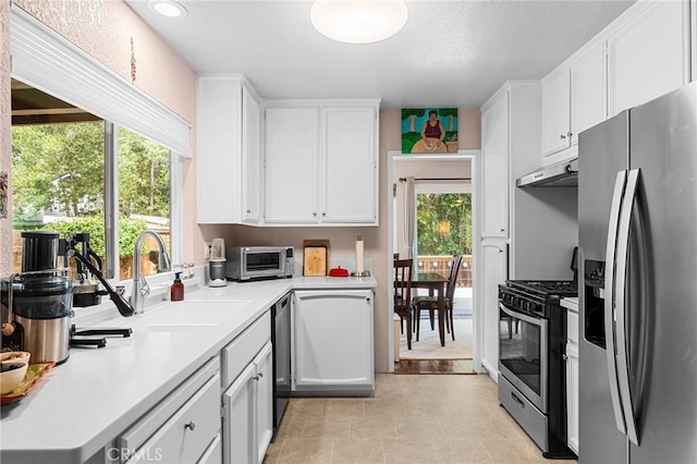 11 Tilden Ln, Chico, CA 95928 - kitchen featuring appliances with stainless steel finishes, white cabinets, light countertops, under cabinet range hood, and recessed lighting