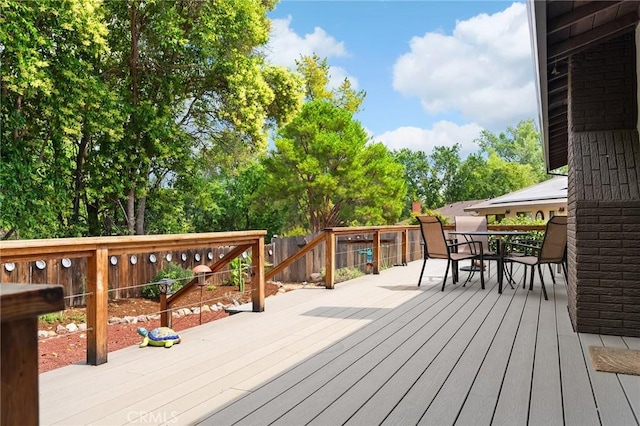 11 Tilden Ln, Chico, CA 95928 - wooden terrace with outdoor dining space and a fenced backyard