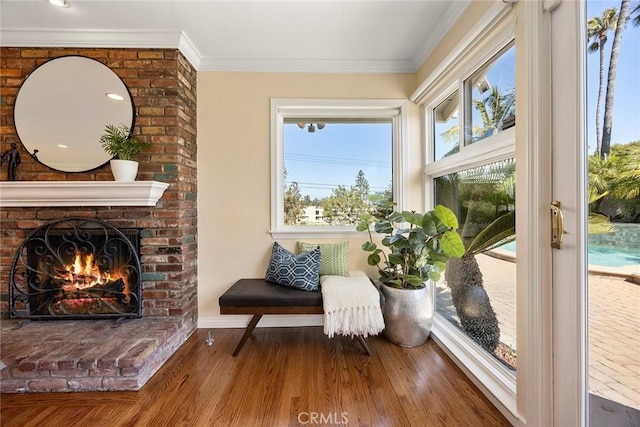 1016 N Highland Ave, Fullerton, CA 92835 - sitting room with wood finished floors, a fireplace, and crown molding