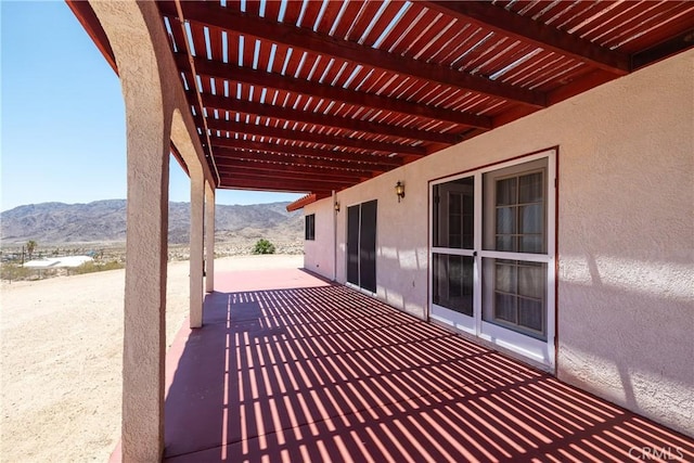 6333 Carodean Rd Unit 29, Palms, CA 92277 - view of patio featuring a mountain view and a pergola