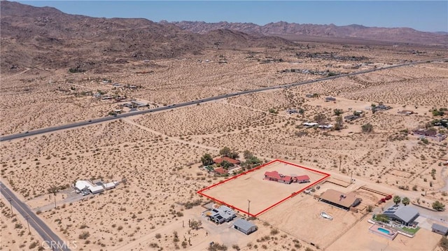 6333 Carodean Rd Unit 29, Palms, CA 92277 - aerial view of sparsely populated area featuring property parcel outlined and mountains