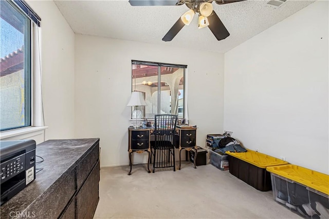 6333 Carodean Rd Unit 29, Palms, CA 92277 - carpeted office space with ceiling fan and a textured ceiling