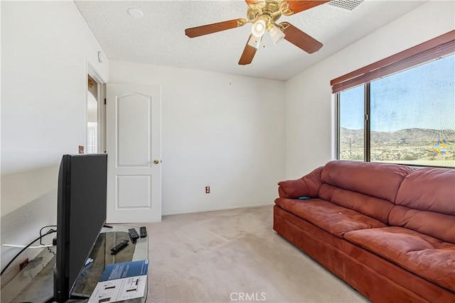 6333 Carodean Rd Unit 29, Palms, CA 92277 - living area featuring carpet flooring, ceiling fan, and a textured ceiling