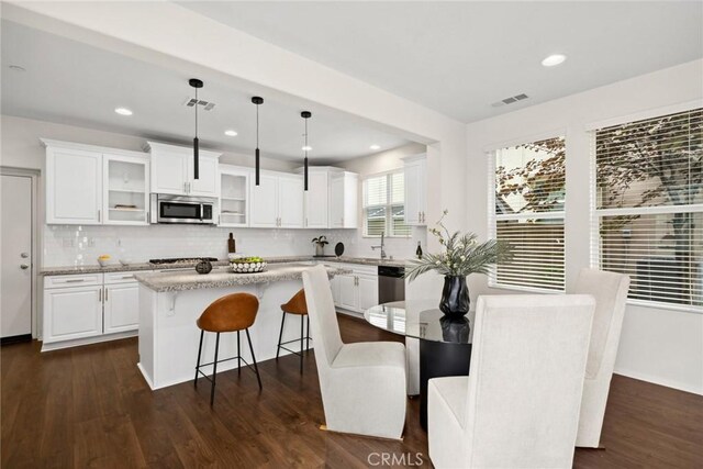 135 Acamar, Irvine, CA 92618 - dining room featuring dark wood finished floors and recessed lighting