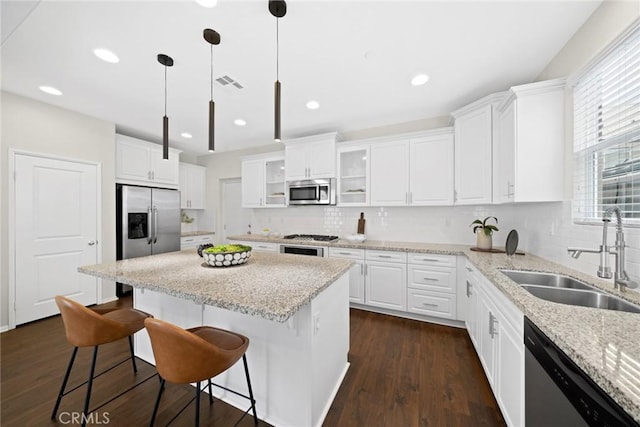 135 Acamar, Irvine, CA 92618 - kitchen with stainless steel appliances, white cabinetry, backsplash, and recessed lighting
