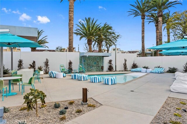 135 Acamar, Irvine, CA 92618 - view of swimming pool featuring a patio area and a fenced backyard