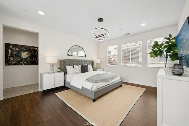 135 Acamar, Irvine, CA 92618 - bedroom featuring dark wood finished floors, a chandelier, and recessed lighting