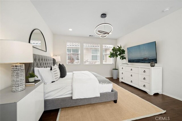 135 Acamar, Irvine, CA 92618 - bedroom featuring dark wood-style flooring, recessed lighting, and a chandelier