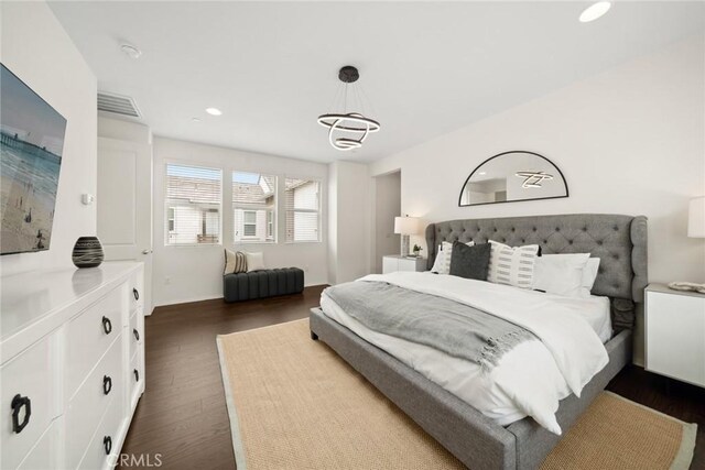 135 Acamar, Irvine, CA 92618 - bedroom featuring dark wood finished floors, a chandelier, and recessed lighting