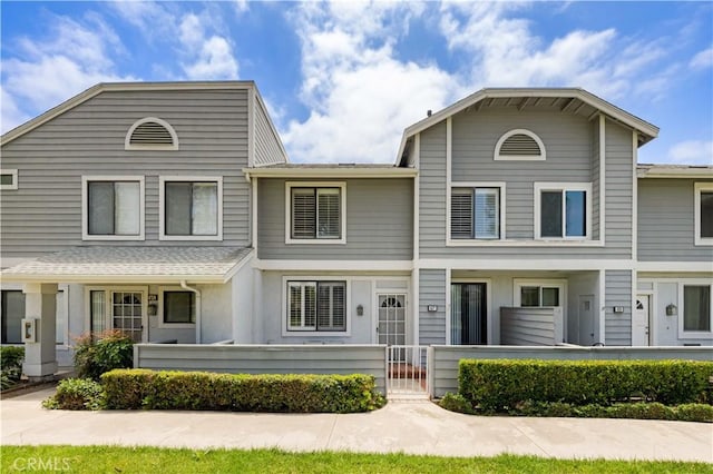 67 Remington Unit 231, Irvine, CA 92620 - multi unit property with a fenced front yard and a gate