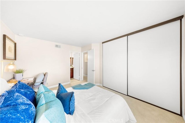 67 Remington Unit 231, Irvine, CA 92620 - bedroom with light carpet and a closet